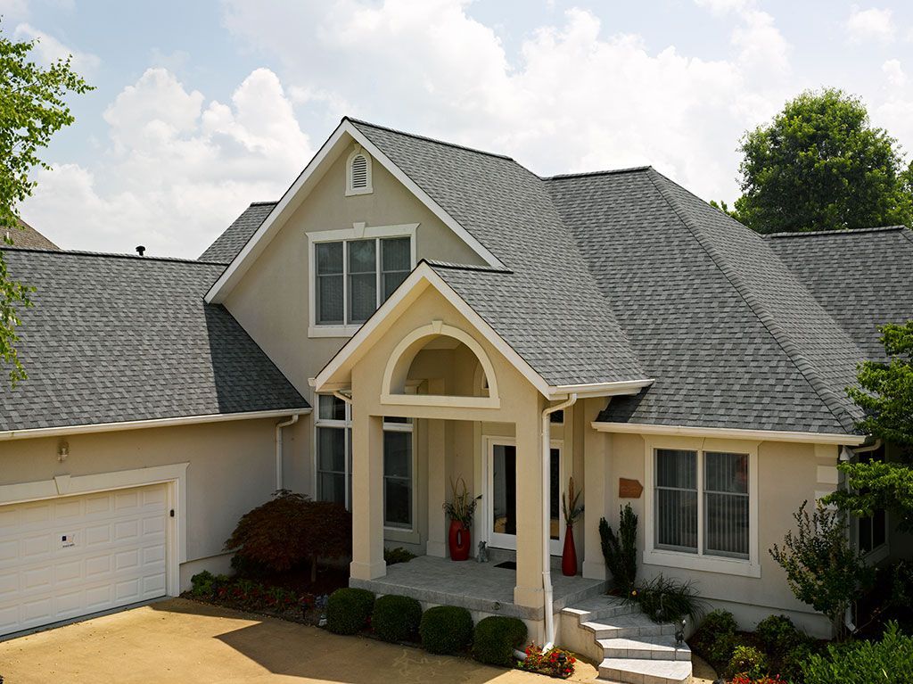 A crisp architectural shingle roof protecting a suburban home